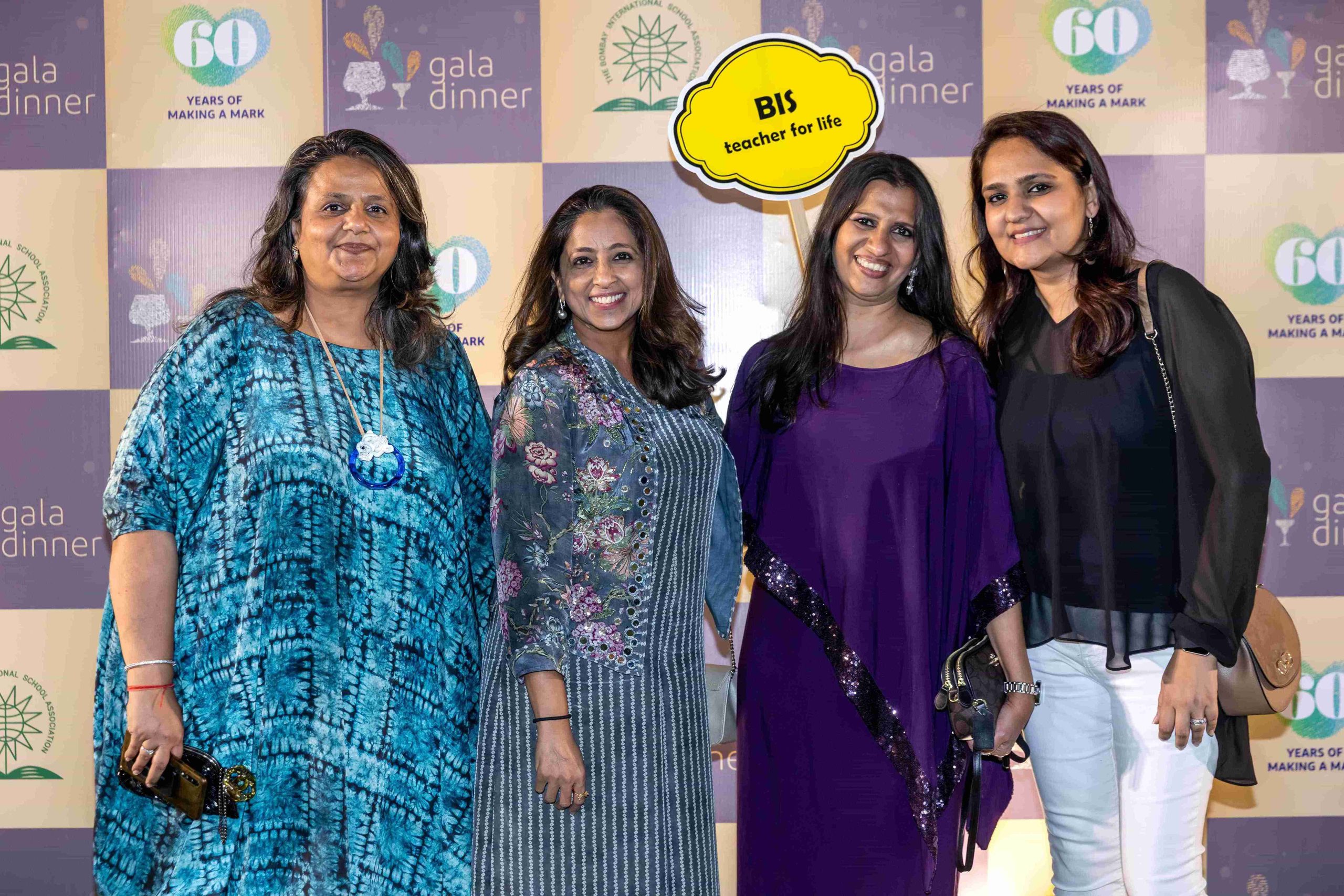 four female teachers posing for camera