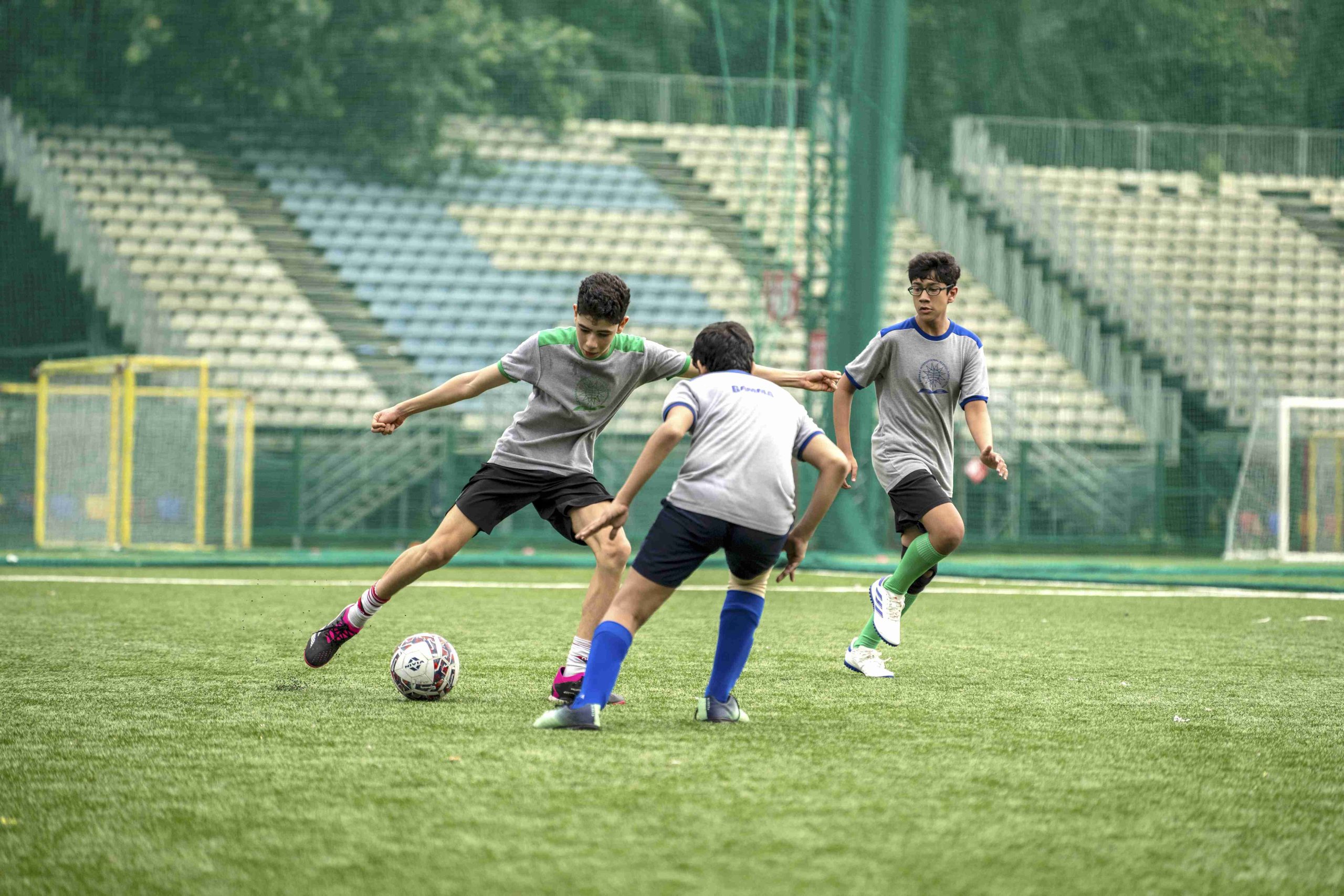 middle school boys playing football match