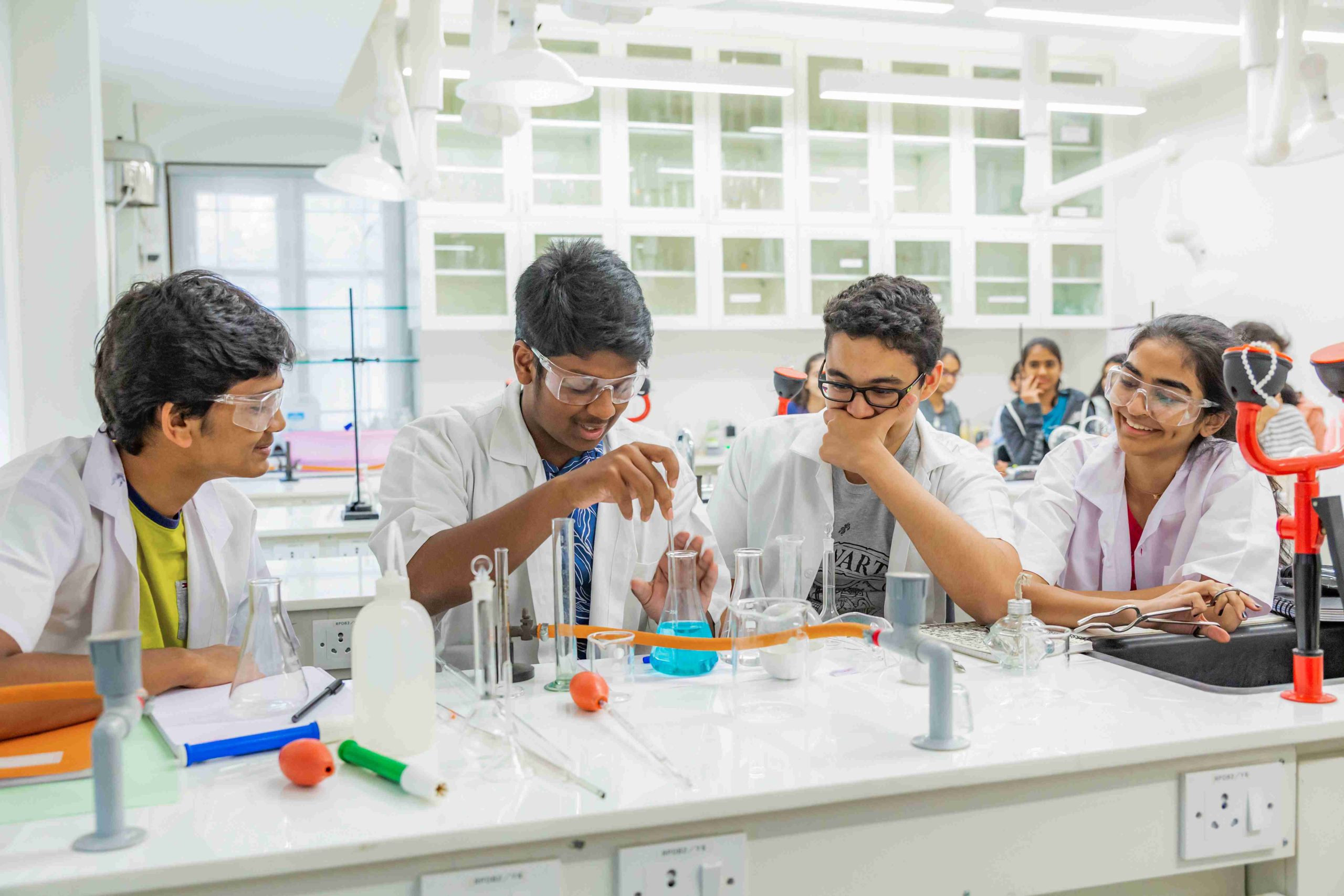 students making a liquid experiment in the lab