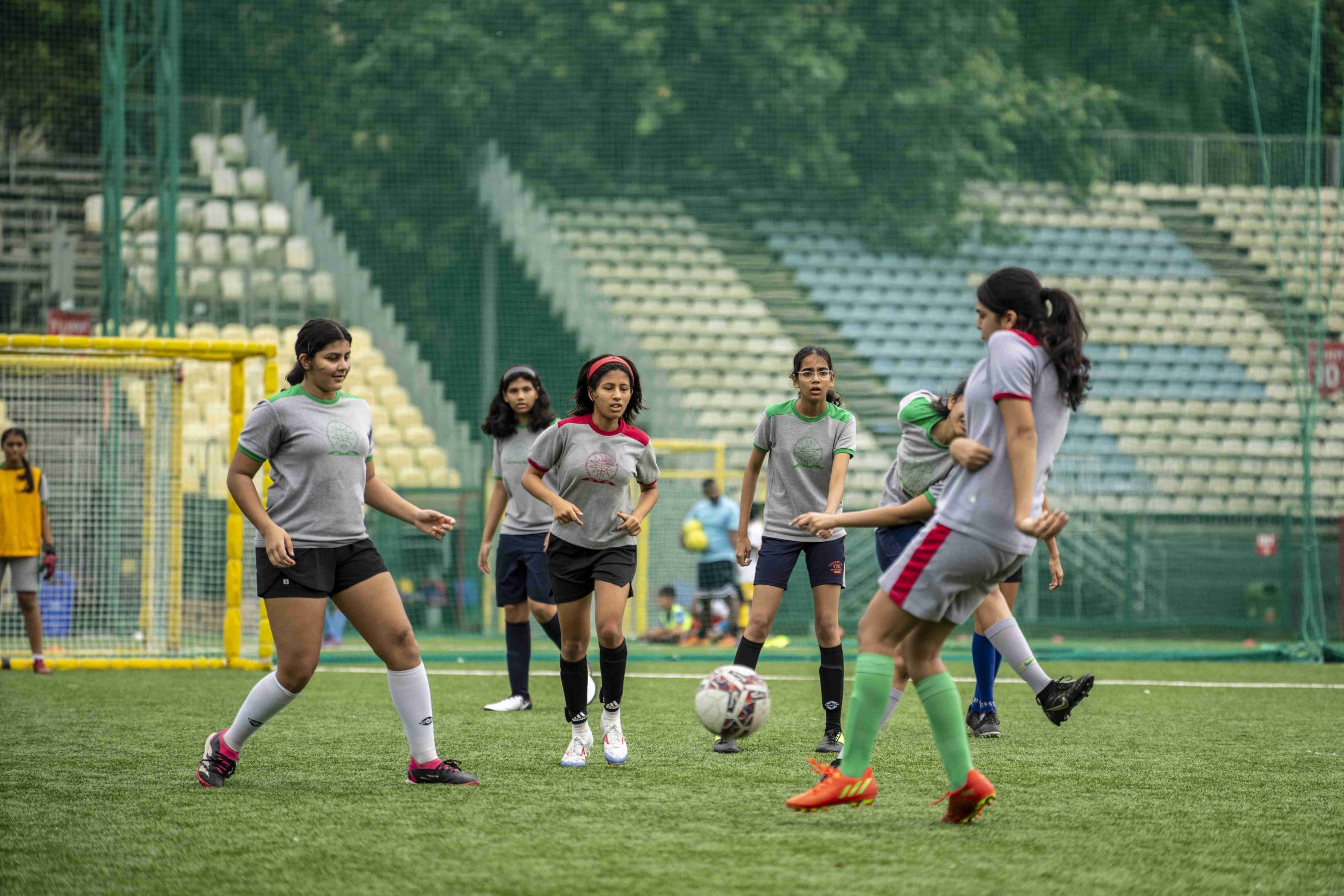 a soccer game is being played by girl's team