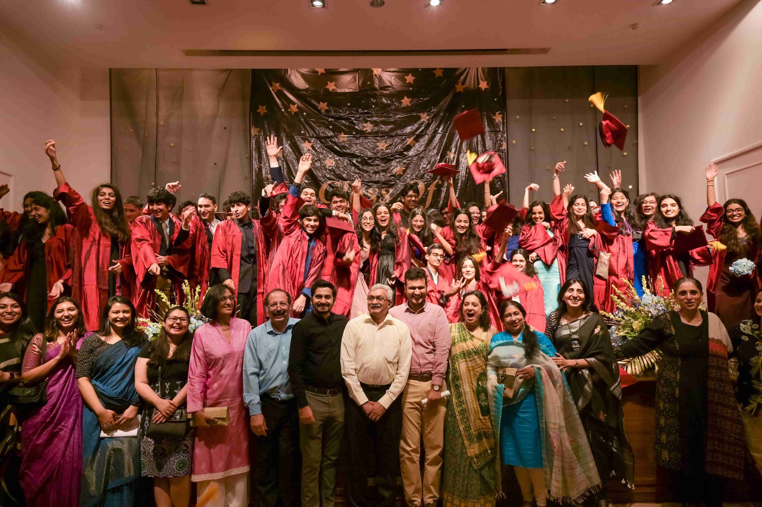 student with their teachers celebrating convocation