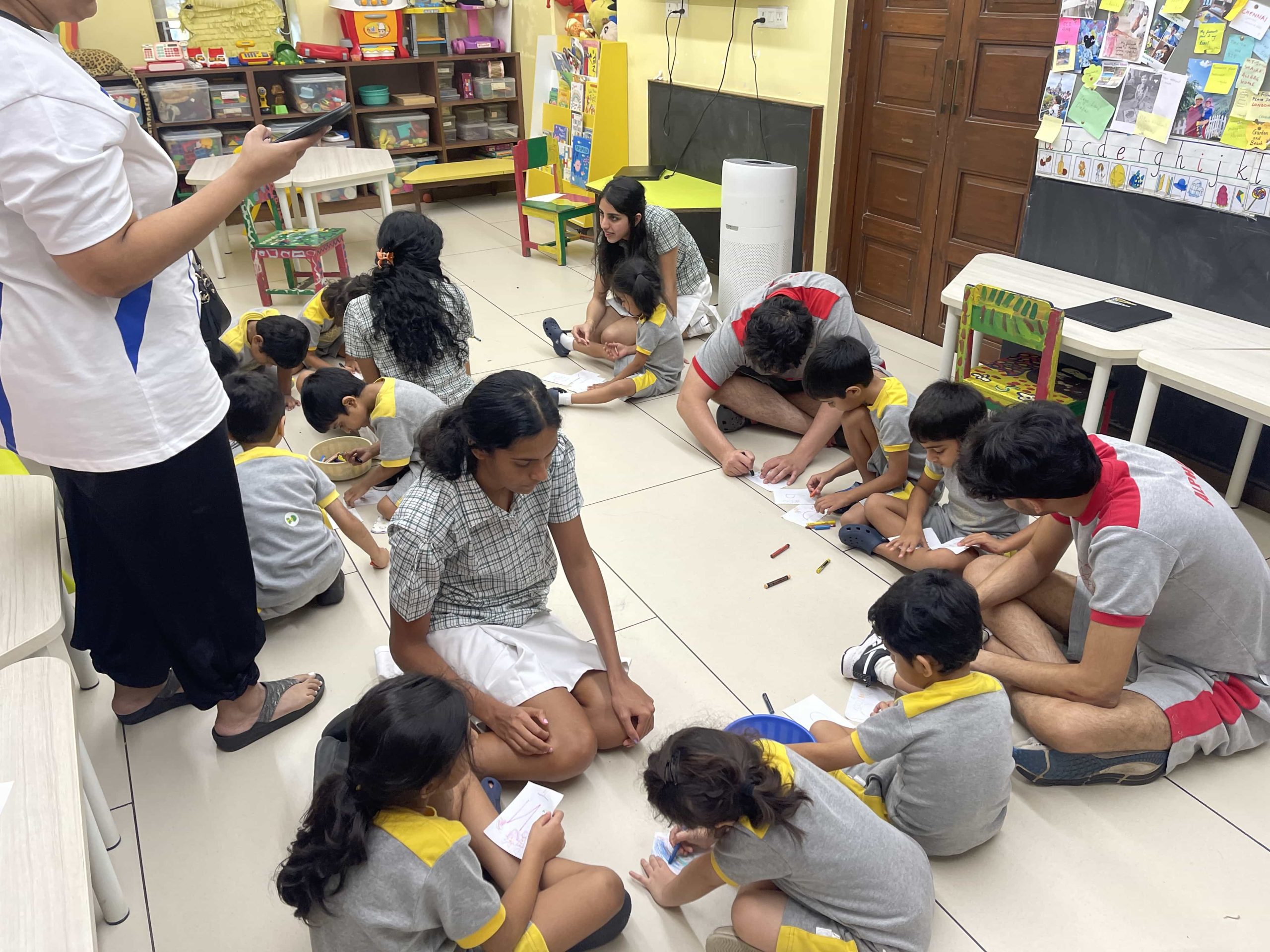 home away from home - elders students helping early years kids