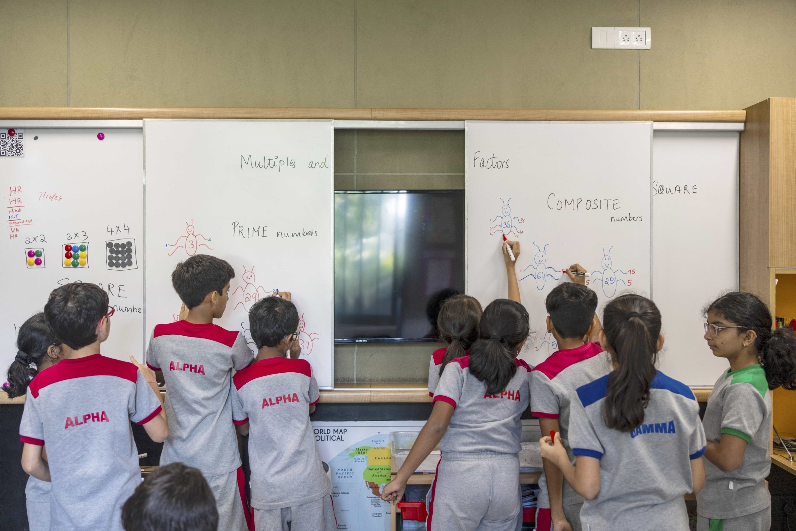 kids have occupied the white board and learning maths